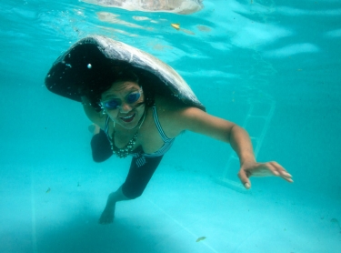 Underwater of Ursula Raymond - of Torres Strait origin with turtle shell in her pool