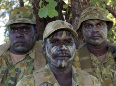 Soldiers of Norforce, who protect and observe Australia's northern coastline patrol in remote bushland. Many of the soldiers are Aboriginal. indigenous military L to R: Elijah Apurryarnk, Pte Leonard Lamilami, Pte Allen Gebadi, of Goulburn Island