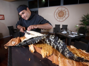 Nitmiluk NP - Cicada Lodge tourism resort - tourism destination - indigenous chef Mark Olive cooks main meal of crocodile tail